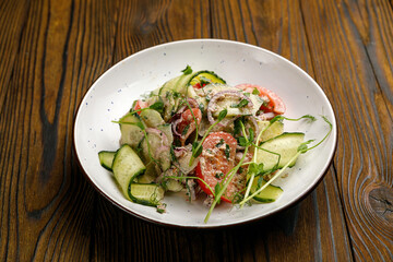 European cuisine. salad on a wooden table
