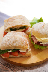 Closeup of Panini sandwiches on wooden board 