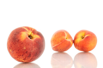 Naklejka na ściany i meble Three sweet organic peaches, close-up, isolated on white background.