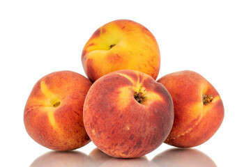 Naklejka na ściany i meble Four sweet organic peaches, close-up, isolated on white background.