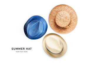Summer straw hats on white.