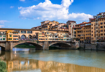 Ponte Vecchio (old Bridge) in Florence, Tuscany, Italy. This medieval stone bridge that spans river...