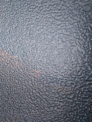 Abstract background. Large drops of rain on the light blue roof of the car.