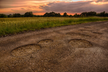 Sunrise over a hole in the road in Beskid Mały - obrazy, fototapety, plakaty
