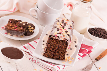 Sponge cake with white frosting and sugars.