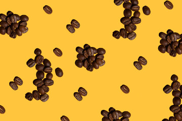 roasted coffee beans on yellow background pattern