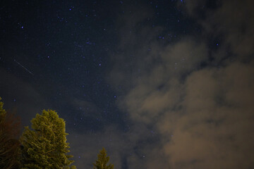 Fototapeta na wymiar Distant Snowy winter mountain stars in the night sky