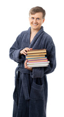 portrait of a man in a gray terry bathrobe. man holds many books and smiles, read a book, relax on a day off, on vacation, after work, quarantine. better at home, stay home. isolated.