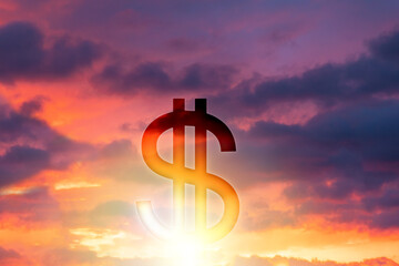 American currency. Dollar symbol on the background of a beautiful sunset or sunrise in the sky. Double exposure. The concept of stock trading, stock market and the crisis