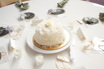 Cake on a table set for a celebration