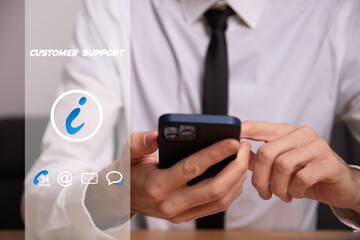 Businessman holding smartphone to contact the customer support