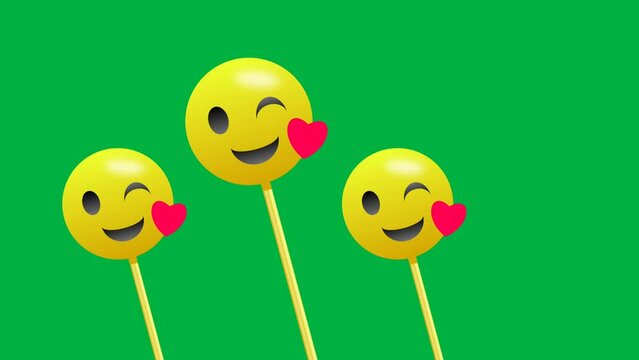 Blink eye love emoji swinging animation isolated on green screen seamless loop animation.