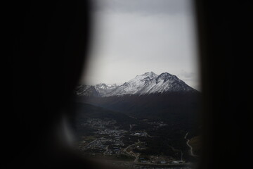 the photo captures the moment of takeoff and flight by plane over Ushuaia &mdash; a city and port in southern Argentina.