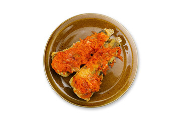 cooked fish on a plate on a white background
