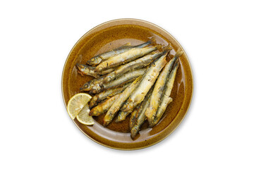 cooked fish on a plate on a white background
