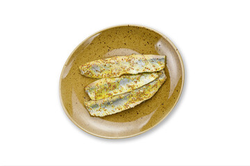 cooked fish on a plate on a white background
