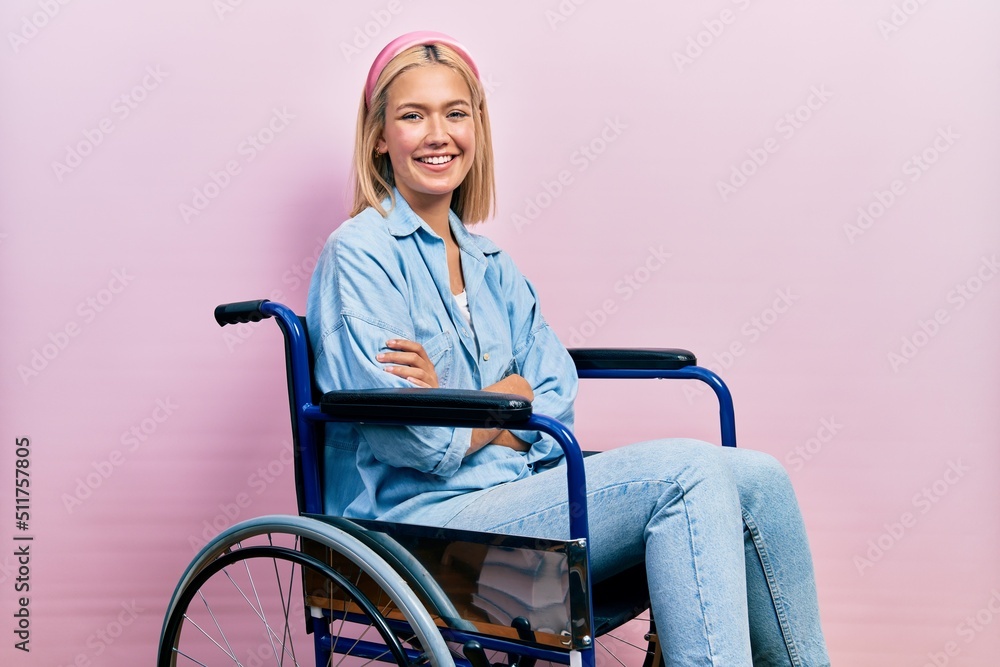 Canvas Prints Beautiful blonde woman sitting on wheelchair happy face smiling with crossed arms looking at the camera. positive person.