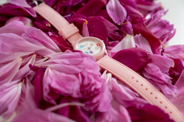 pink silicon watch on rose petals 