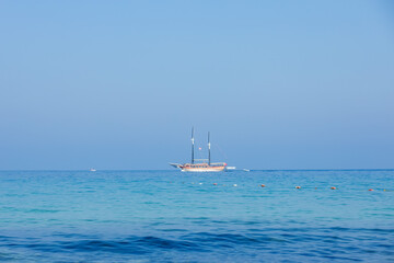 A cruise ship sailing on the sea. Travel by ferry. Sea cruise on a ship. Blue seascape with ship. Sea voyage