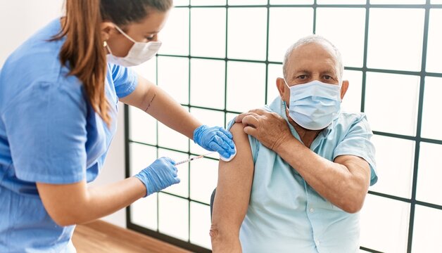 Senior Man With Safety Mas Getting Vaccinated With Covid 19 Immunity Vaccine, Nurse Injecting Prevention Vaccine