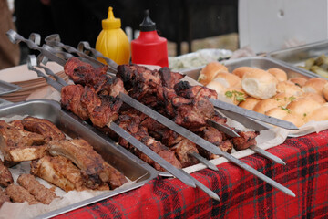 Roasting juicy meat steak with spices in burning charcoals fire on bbq grid
