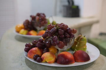 Fruit slicing at a wedding banquet. Grapes, peach and pineapple