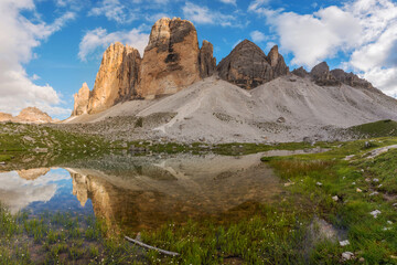 Mountain reflection in lake by Tre Cime di Lavaredo in Dolomites - obrazy, fototapety, plakaty