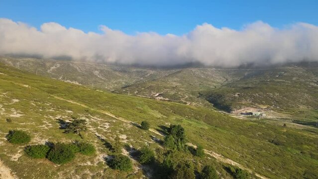 The journey to the summit over mountains, clouds, green grass, overcoming difficulties, being strong, you will definitely succeed, never give up