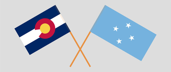 Crossed flags of The State of Colorado and Micronesia. Official colors. Correct proportion