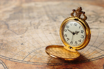 Ancient gold pocket watch on vintage marine map - Powered by Adobe