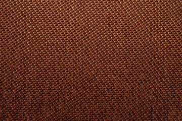 Brown background with dense textured fabric for sun blinds or mat, wallpaper, close up. Fabric background