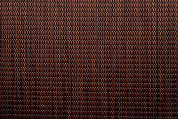 Wicker background made of natural straw. Full frame of densely woven straw pattern. Natural, natural background