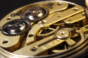 Old mechanical pocket watch. Clockwork gears wheels, close-up view