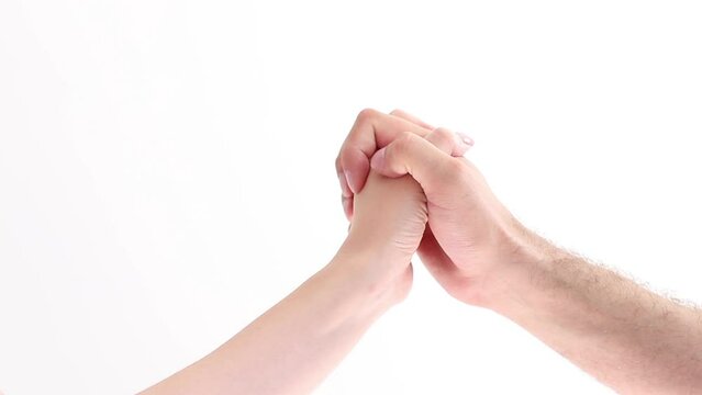 hand of a man and a woman on a meeting on a white background. love and relationship