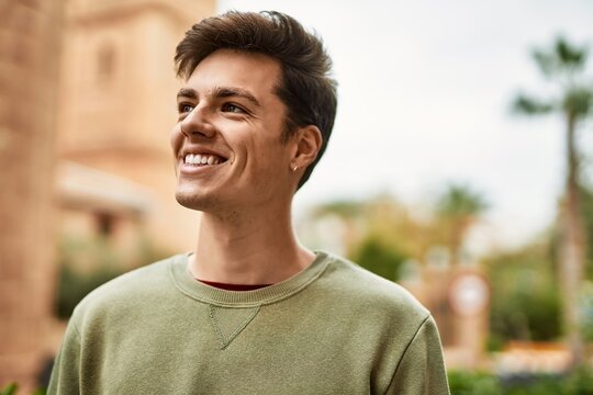 Young Hispanic Man Smiling Happy Standing At The City.