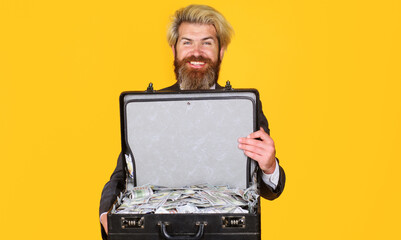 Business success. Smiling businessman with briefcase full of money. Lending service. Wealth and rich.