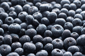 big box with scattered fresh blueberries, fresh raw food, natural healthy food