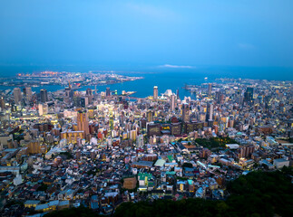 Fototapeta na wymiar Aerial view of lights from downtown Sannomiya and Kobe City at dusk