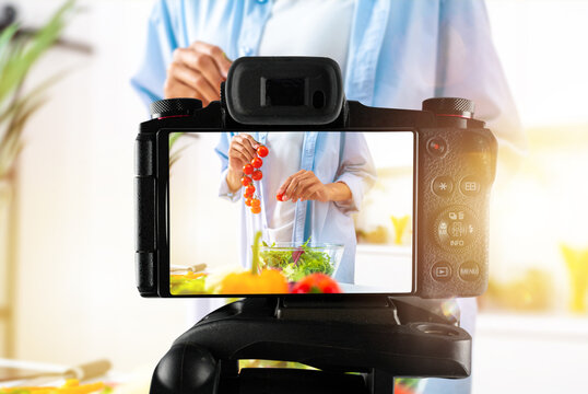 Vlogger woman chef records a video of cooking recipe