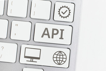 Concept API or Application programming interface. Business acronym. Text and icons on the keyboard