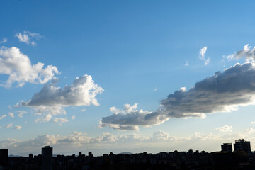 city silhouette, cloudy weather, building shadow, sunny wheather, sky, clouds, sunset