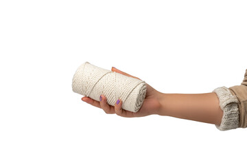 Macrame rope held in female hand, white background, isolated, close-up, beautiful