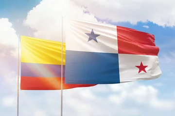 Foto op Canvas Sunny blue sky and flags of panama and colombia © prehistorik