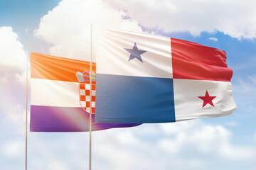 Sunny blue sky and flags of panama and croatia