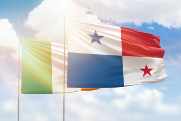 Sunny blue sky and flags of panama and ireland