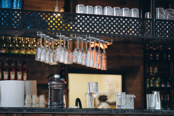 Bar counter and hanging glasses