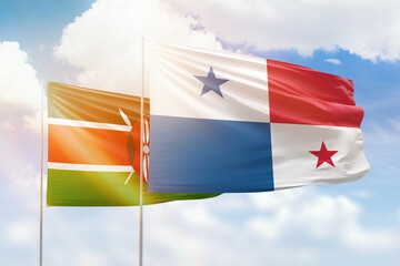 Sunny blue sky and flags of panama and kenya