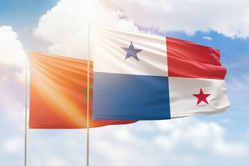 Sunny blue sky and flags of panama and morocco