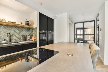 Spacious bright kitchen with dining area, modern design and panoramic windows