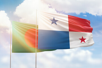 Sunny blue sky and flags of panama and bangladesh